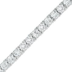 Elegant and affordable, this sparkling tennis-style bracelet is a great look any time. Fashioned in sleek sterling silver, this bracelet features a row of glistening 5.0mm lab-created white sapphires in durable four-prong settings. Buffed to a bright luster, this 7.5-inch bracelet secures with a lobster claw clasp. Classic Sterling Silver Bracelet With Sparkling Stones, Classic Bracelets With Sparkling Stones, Classic White Diamond Bracelet With Sparkling Stones, Classic Silver Channel Set Diamond Bracelet, Channel Set Cubic Zirconia Tennis Bracelet, Cubic Zirconia Channel Set Tennis Bracelet, Classic Silver Tennis Bracelet With Prong Setting, Silver Channel Set Tennis Bracelet, Classic Cubic Zirconia Tennis Bracelet With Diamond Cut