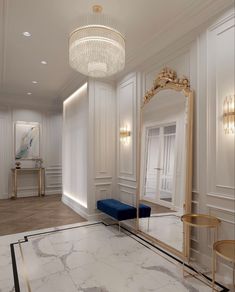 a large mirror sitting in the middle of a room next to a blue bench and table