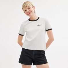 A wardrobe staple this classic-fit cotton T-shirt features our embroidered cursive Coach script. The crewneck is finished with contrast trim. | Coach Ringer T-Shirt - Women's Size Large - White Trendy Crew Neck Top With Contrast Stitching, Casual Cotton Coach Tops, Casual Summer T-shirt With Letter Embroidery, Coach Cotton Crew Neck Tops, Cotton Tops With Letter Embroidery In College Style, Cotton College Style Top With Letter Embroidery, Casual Coach Crew Neck Tops, Summer Crew Neck Top With Contrast Stitching, Casual Crew Neck Top With Contrast Embroidery