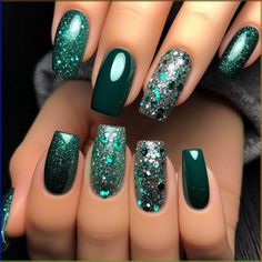 Most nails are painted with a deep, luxurious emerald green polish. The ring fingers feature a striking glitter accent, combining emerald and silver glitter for a dazzling effect. The glitter is densely packed, creating a sparkling contrast against the solid emerald nails. The overall look is glamorous and eye-catching. Glitter Emerald Green Nails, Emerald Green Silver Nails, Emerald Green Glitter Nails, Short Green Nails Ideas, Green Nails Glitter, Green And Silver Nails, Cute Nails Almond, Almond Nails Nail Art, Green Glitter Nails