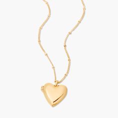 Fall in love with this golden locket that's shaped like a heart. Get lost in the timeless style of the Isla Heart Locket, sure to be your newest accessory crush. Perfect for wearing your heart outside your chest. Available in 14k gold plated brass Pendant size: 5/8" by 3/4" 16" satellite chain with 2" extender Lobster claw closure Water resistant and protective anti-tarnish barrier SKU: BYN1435 Golden Locket, Straight From The Heart, Modern Jewellery Design, Wishlist 2024, Heart Shaped Pendant, Gift Kit, Heart Shape Pendant, Sweet Gifts, Heart Locket