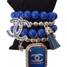 This Fashion Designer Charm Bracelet Is A Must-Have For Any Jewelry Collection. With A Stylish Round Shape And A Slide Closure, It Is Perfect For Any Occasion Like Engagement, Graduation, Or Anniversary. The Bracelet Is 7.5 Inches In Length And Consists Of 4 Stackable Units, Each Handmade With Blue And Silver Beaded Charms. The Bracelet Is Customized With A Glam Theme And Features No Main Stone Or Gemstones. It Is Signed By Ashleymarieboutique And Comes With No Seller Warranty. This Charm Bracel Blue Adjustable Charm Bracelet For Party, Adjustable Blue Charm Bracelet For Party, Adjustable Blue Charm Bracelet For Parties, Elegant Blue Metal Beaded Bracelets, Elegant Blue Beaded Metal Bracelets, Beaded Charms, Jewelry Organizer Diy, Creating Jewelry, Jewelry Organization