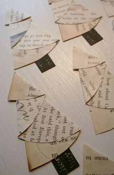 several pieces of paper cut out to look like christmas trees with words on them, all in different shapes and sizes