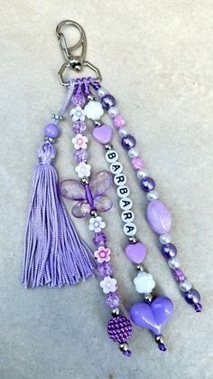 a keychain with beads and charms attached to it