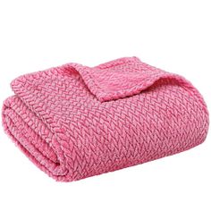 a pink blanket folded on top of each other