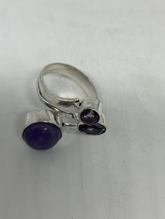 Large genuine amethyst Vintage ring Low content silver not sterling. Size adjusts Can be resized by my jeweler for $15-$20 All rings are shipped free in the US in a nice gift box. Check out our over a THOUSAND great reviews Engraving is $4 per letter and is not always perfect depending on the piece. It can take a few days if the jeweler is busy. This is payable to Paypal Judithsltd@gmail.com Amethyst Gem, Ring Vintage, Purple Band, Amethyst Ring, Cocktail Rings, 925 Sterling Silver Ring, Vintage Rings, Silver Fashion, Statement Rings