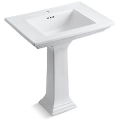 a white pedestal sink on a white background