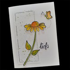 a card with a flower and butterflies on it