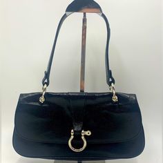 Features Crafted From Supple, Embossed, Snake-Like Black Calfskin Leather Silver-Tone Hardware Single Shoulder Strap Fold-Over Flap Equestrian Horsebit Charm On Flap Magnetic Snap Closure Canvas Lining Slit Interior Pocket Size 11.5”W X 6”H X 1.5”D Shoulder Strap: 7” Condition This Preloved Shoulder Bag Is In Very Good Condition With Minor Signs Of Wear Including Light Scuffs, Rubbing And Some Scratches On The Hardware. This Darling Little Satchel Fits Snuggly Under Your Arm. Please Look Careful Baguette Purse, Burberry Handbags, Leather Silver, Pocket Size, Burberry Bag, Emboss, Equestrian, Calf Skin, Burberry