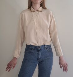 "approximate age 1950s (maybe older) long sleeve silk button-up blouse measurements: length 2#\", pit-to-pit 22\", sleeve 21\" good pre-owned vintage condition, small flaws throughout, see pics Feel free to bundle with other items  for reference model is 5'9\", Bust 34\" Waist 25\" Hip 37\" Items are pre-owned with possible flaws as expected with vintage. Major flaws will be noted in description." Vintage Silk Collared Top, Vintage Beige Shirt For Spring, Vintage Collared Blouse With Placket, Vintage Button-up Blouse With Placket, Vintage Collared Formal Shirt, Vintage Button-up Blouse For Fall, Vintage Beige Button-up Top, Vintage Formal Collared Shirt, Vintage Peter Pan Collar Blouse For Work