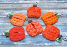 four zippered pumpkins sitting on top of each other