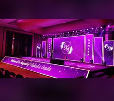 the stage is set up for an event with purple lighting and sound effects on it