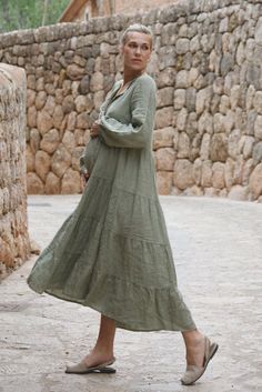 Style // A classic faded green linen dress to take you through every season in style Designed to be dressed up or kept cool and casual, this forever timeless maxi dress is the secret to style through every season. Featuring a tiered skirt detail, mother of pearl buttons down the front, and elastic sleeves for added shape and practicality. A true goes with everything essential for every wardrobe Fabric Note // Made in Italy from 100% Linen Sizing Advice // Available in one size, the loose fit all Flattering Black Dress, Green Linen Dress, Mama Cloth, Dress Sage, Elastic Sleeves, Fall Family Photos, Fall Family, Mother Of Pearl Buttons, Pearl Buttons