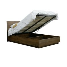 a bed with a mattress on top of it and an open drawer underneath the bed