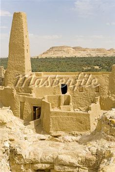 an old adobe building in the desert