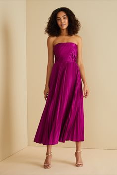 Be my Valentine in our Conan Dress. Made from 100% recycled polyester, it features a fitted bodice and pleated A-line skirt, perfect for any special occasion. Its slightly stretchy fabric ensures comfort without compromising on the show-stopping, vibrant style you will love. Strapless Bustier Dress, Fuschia Midi Dress, Berry Colored Dress, Bright Jewel Tone Bridesmaid Dresses, Purple Semi Formal Dresses, Bright Purple Bridesmaid Dresses, Purple Sangria, Magenta Bridesmaid Dresses, Purple Wedding Guest Dresses