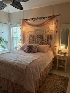 a bedroom with a large bed and lots of lights