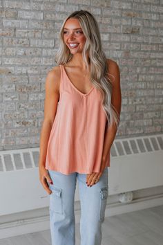 Details: Baxter Ribbed Tank V-Neckline No Sleeves Ribbed Material Good Stretch Washed Look Center Seam Detailing Relaxed Fit Available in 9 Colors Material: 92% Rayon and 8% Spandex Measurements: Small - Bust: 34" | Length: 24" Medium - Bust: 36" | Length: 24.5" Large - Bust: 38" | Length: 25" Women Dress Collection, Peach Shirt, Dream Jeans, Stylish Sandals, Comfortable Flats, Ribbed Tank, Good Stretches, Large Bust, Small Bust