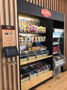 a vending machine in a store filled with food