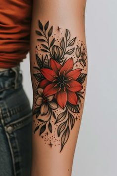 a woman with a flower tattoo on her arm