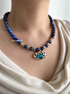 Lapis Lazuli Gold-Filled Necklace with Ceramic Evil Eye Pendant 
#handmade #evileye #lapislazuli #necklace #jewellerydesign #gemstonenecklace #gemstonejewelry #statement #statementjewelry #moonstone #aventurine #etsy #etsyseller #chunkynecklace #boho #bohemian #bohochic #etsy #etsyseller #art #design Ceramic Evil Eye, Autumn Necklace, Chrismas Gifts, Eye Pendant, Evil Eye Pendant, Chunky Necklace, Moon Stone, Boho Bohemian, Statement Jewelry