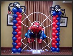 a spiderman balloon sculpture on display in an office