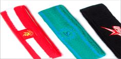 three pairs of wristbands with red, green and blue designs on them are lined up next to each other