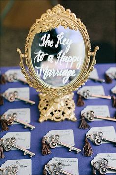 a table topped with lots of different types of wedding pins