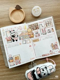 an open notebook with panda and other items on it