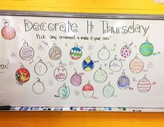 a white board with ornaments drawn on it in front of a yellow wall that says decorate it thursday