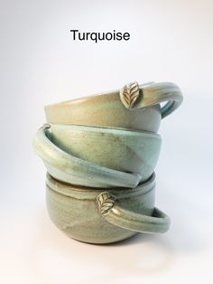 there are three bowls stacked on top of each other with the words turquiose written above them