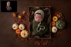 a baby is sleeping in a box surrounded by pumpkins and other fall leaves, with an infant's head resting on the pillow