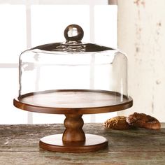 a wooden base with a glass cover on top