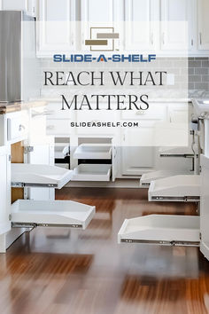 a kitchen with white cabinets and wood flooring that says, slide - a - shelf reach what matters