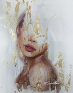 a painting of a woman's face with gold paint