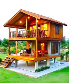 a large wooden house sitting in the middle of a lush green field with stairs leading up to it