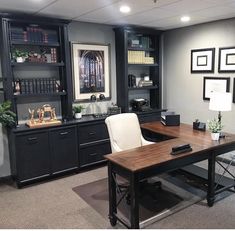 an office with black cabinets and white chairs