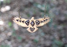 "This listing is for one hand stamped brass hawk necklace. Wear this bohemian necklace to show your affinity and love for all things natural, spiritual, and sky-bound. It is a powerful and eye-catching piece. - Hawk is made from 18 gauge brass sheet metal. This is a sturdy piece- it is not flimsy. - Pendant measures 3\" by 1 1/4\" (75mm by 30mm) - Chain in photo measures 16\" from end to end, but can be lengthened to your preference. Choose at check-out! Also, I can suspend it on black or brown Bohemian Hand Forged Necklaces For Festivals, Bohemian Etched Bronze Jewelry, Bohemian Etched Necklaces For Festivals, Stamped Bronze Brass Necklace, Bohemian Engraved Brass Necklaces, Bronze Stamped Brass Necklace, Bohemian Stamped Jewelry For Jewelry Making, Spiritual Etched Brass Necklace, Bohemian Brass Stamped Jewelry