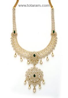 18 karat gold 'detachable - 4 in 1' diamond long necklace with color stones & south sea pearls
    it can be used as a short necklace
  this product has a detachable pendant which can be used as a separate pendant with most chains.
  this product has inter changeable stones in the necklace and pendant.
   length of the short necklace without pendant & back chain : 8.00 inches 
  length of the pendant : 3.50 inches
  width of the pendant : 2.15 inches    

introducing our exquisite 18 karat gold Traditional Gold Emerald Necklace With Diamonds, Hand Set Yellow Gold Emerald Necklace For Wedding, Gold Diamond Necklace With Detachable Pendant For Wedding, Gold Emerald Necklace With Intricate Design For Reception, Dazzling Gold Emerald Necklace For Wedding, Gold Diamond Necklace With Stone Work, Traditional Gold Diamond Necklace With Stone Work, Dazzling Hand Set Gold Emerald Necklace, Gold Emerald Necklace For Reception