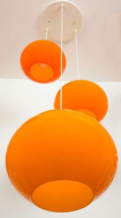 an orange chandelier hanging from the ceiling