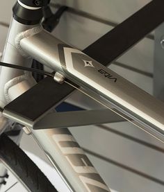 a close up view of the front end of a bike's frame and seatpost