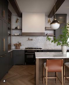 a kitchen with wooden floors and gray cabinets