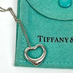 Tiffany & Co Elsa Perretti Open Heart Small Necklace %100 Authentic Tiffany & Co Open Heart Small Necklace Chain Folded In Half Is 9" See Picture Needs To Be Polished, Previously Loved But In Great Condition Fast Shipper Does Not Include The Tiffany’s Bag But Will Be Wrapped In A Brand New White Jewelry Box And Inside A White Sash Bag Luxury White Gold Heart Necklace For Formal Occasions, Luxury White Gold Heart Necklace For Formal Events, White Gold Luxury Heart Necklace For Formal Occasions, Luxury Sterling Silver Heart Necklace For Formal Occasions, Hallmarked Open Heart Necklace, Elegant Heart Pendant Necklace With Hallmarks, Classic Formal Necklaces For Valentine's Day, Formal White Gold Heart Necklace Hallmarked, Classic Valentine's Day Formal Necklace