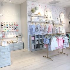 a clothing store filled with lots of baby clothes