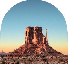 a large rock formation in the middle of a desert