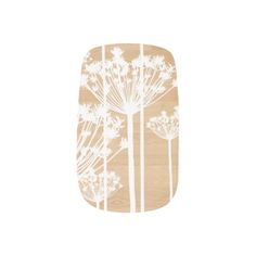 a wooden phone case with white flowers on it