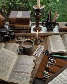 an open book sitting on top of a wooden table