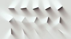 an abstract white background with curved lines and shapes that appear to be folded or folded