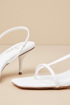 Dip your toe into an ultra-chic look with the Lulus Toinette White Strappy Slingback High Heel Sandals! Smooth faux leather shapes these sleek heels that feature a trendy square toe bed, a slender vamp strap, and a thong-style upper that continues into a slingback-style strap (with elastic at the side for fit). A low stiletto heel completes the barely-there look! 2. 75" wrapped stiletto heel. Cushioned insole. Rubber sole has nonskid markings. Man made materials. Imported. Lulus | Toinette White White Slingback Sandals With 4-inch Heel For Summer, White Slingback Sandals With 4-inch Heel For Party, Chic White High Heel T-strap Sandals, White Open Toe T-strap Sandals With Heel Strap, White Open Toe Slingback Sandals With 4-inch Heel, Sandal Heels, Heel Sandal, Heel Sandals, Strappy Sandals