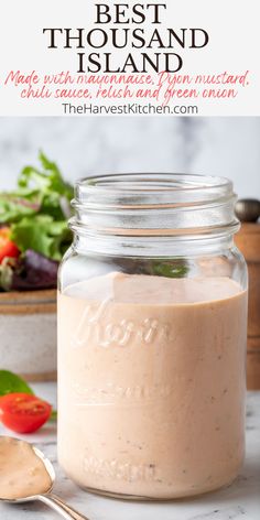 the best thousand island mayonnaise in a mason jar with a spoon next to it